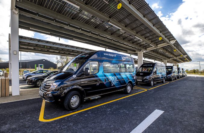 electric mini bus at a vehicle charger