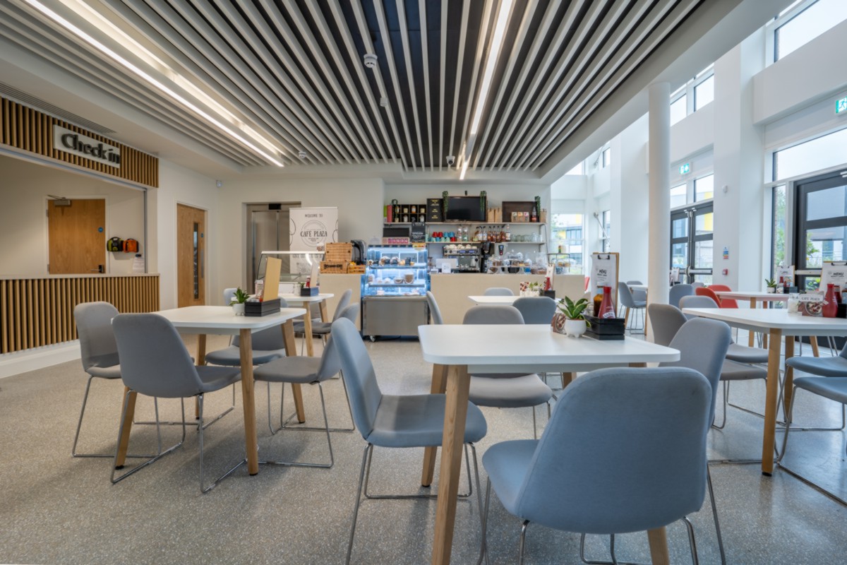 Empty cafe with tables and chairs in the Plaza